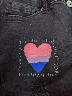 a heart in the bisexual pride colors