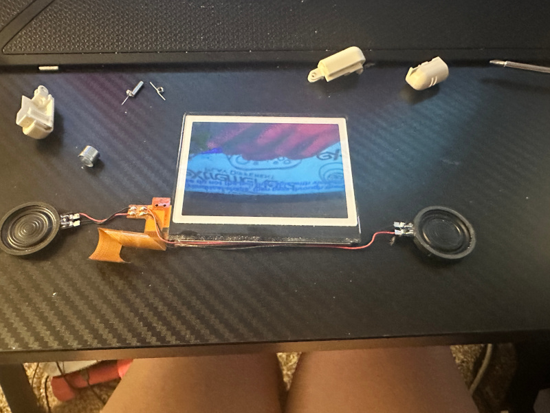 the ds lite top screen fully removed with the speakers attached